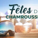 Un masque de ski posé sur une table au soleil où se reflète la montagne enneigée, 3 bouteilles de champagne arrière plan : profitez des Fêtes de Chamrousse avec Stay in Isère.